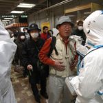 An evacuee is screened for radiation exposure at a testing center Tuesday, March 15, 2011, in Koriyama city, Fukushima prefecture, Japan, after a nuclear power plant on the coast of the prefecture was damaged by Friday's earthquake.